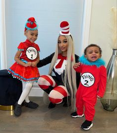 three children dressed up as dr seuss and cat in the hat