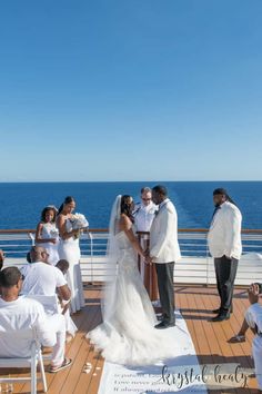 a couple getting married on the deck of a cruise ship