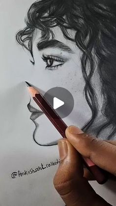 someone is drawing a woman's face with a pencil