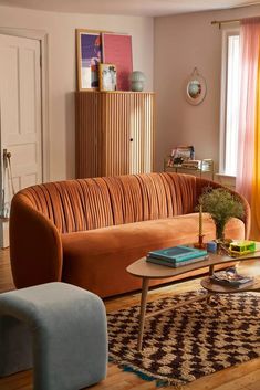 a living room filled with furniture and decor