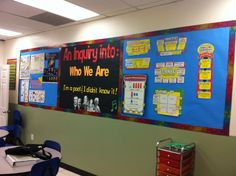 an empty classroom with posters on the wall