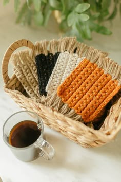 crochet coasters in a basket next to a cup of coffee