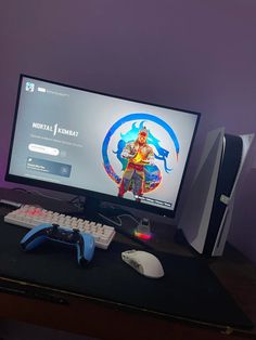 a computer monitor sitting on top of a desk next to a keyboard and mouse,