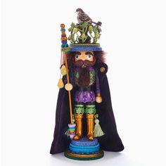 a nutcracker figurine with a bird perched on it's head