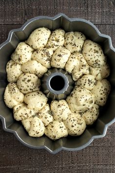 a bundt cake pan filled with rolls covered in poppy seed sprinkles