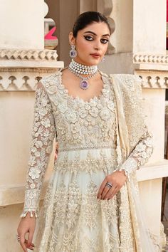 Pakistani Bridal Ensemble in White Gown and Dupatta Style White Anarkali Dress For Wedding, Embellished Anarkali Dress For Ceremony, Elegant Evening Dress With Intricate Embroidery For Wedding, Elegant Wedding Evening Dress With Intricate Embroidery, White Anarkali Dress Hand Embellished, White Hand Embellished Anarkali Dress, Elegant Floor-length Ball Gown With Intricate Embroidery, White Dresses With Pearl Embroidery For Reception, Cream Floor-length Wedding Dress For Ceremony