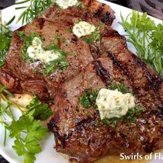 a plate with steak and vegetables on it