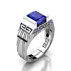 Urban monumental, luxurious and rich, this men's 950 Platinum ring centers a 3.0 carat lab created top quality emerald cut royal blue sapphire, ornate with Mesoamerican architecture design elements. All sizes are available. This elegant men's ring showcases sophisticated Modern Aztec design which evokes statement of true character and timeless style.Platinum weight is approx. 12 grams and ring comes officially stamped PLAT. It takes 10 to 12 business days to make and shipFree insured USPS delive Wedding Rings Pink Sapphire, Blue Sapphire Wedding Ring, Amethyst Wedding Rings, Topaz Wedding Ring, Ruby Wedding Rings, Modern Wedding Rings, Amethyst Wedding, Emerald Wedding Rings, Sapphire Wedding Rings