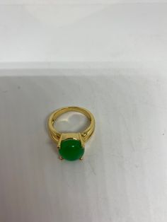 Vintage Lucky Green Nephrite Jade ring Fun jade is color enhanced Large green nephrite jade Ornate German Gold finished Vintage ring, does not tarnish, NOT sterling Size 6.5, 7 or 9 All rings are shipped free in the US in a nice gift box. Check out our over a THOUSAND great reviews Engraving is $4 per letter and is not always perfect depending on the piece. It can take a few days if the jeweler is busy. This is payable to Paypal Judithsltd@gmail.com Green Emerald Cabochon Rings, Green Jade Round Stone Jewelry, Green Jade Jewelry With Round Stone, Green Open Ring For Formal Occasions, Green Open Ring For Formal Events, Green Jade Round Band Jewelry, Formal Green Open Ring, Green Emerald Crystal Ring, Green Chrysoprase Gemstone Rings