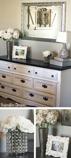 a dresser with flowers and a mirror on top