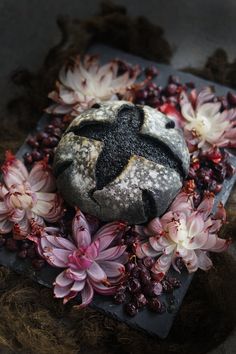 a piece of bread sitting on top of flowers