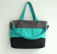 *** Please check 'shop announcement' for production time and delivery before your purchase. ***This bag is made from teal, grey and black water-resistant nylon, a sturdy and durable material. It is very roomy and big enough to hold lots of your essentials. You can use it as a everyday bag, school bag, laptop bag (please check dimensions), messenger bag or diaper bag.If you prefer this style in different colors, you can see color samples from my other  listings : http://www.etsy.com/shop/tippytha Green Tote Diaper Bag For Everyday Use, Everyday Green Tote Diaper Bag, Green Tote Diaper Bag For Daily Use, Green Rectangular Diaper Bag For On-the-go, Rectangular Green Diaper Bag For Everyday Use, Trendy Tote Bag For Trips, Green Large Capacity Shoulder Bag For Trip, Green Shoulder Bag For Trip With Large Capacity, Green Shoulder Bag With Large Capacity For Trips