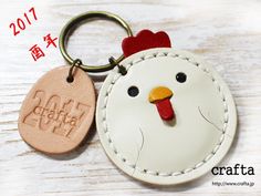 a key chain with a chicken on it