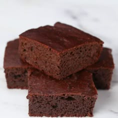 chocolate brownies stacked on top of each other