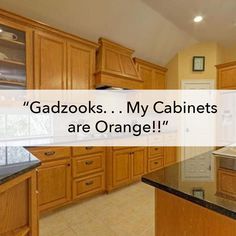 a large kitchen with wooden cabinets and granite counter tops that says gadzooks my cabinets are orange