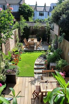 an outdoor garden with wooden benches and tables