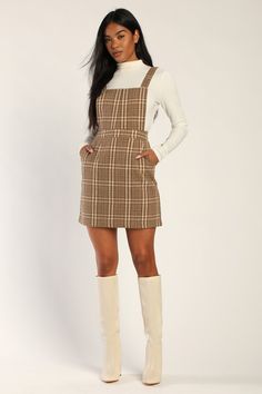 You'll be reaching for the Lulus Plaid to Be Yours Beige and Brown Plaid Pinafore Mini Dress all season long like it was made just for you! Brushed, wool-inspired woven fabric, with a brown and ivory plaid atop a beige background, shapes this cute pinafore dress that has a square neckline, an apron-style bodice, and wide straps that secure with hidden buttons at the back. A banded waist tops an A-line mini skirt with diagonal front pockets. Hidden zipper/clasp at back. Fit: This garment fits tru Plaid Dress Outfit, Winter Club Outfits, Plaid Overall Dress, Plaid Jumper, Club Outfits For Women, Fall Dress Outfit, Lulu Fashion, A Line Mini Skirt, Pinafore Dress