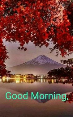 the words good morning are in front of a lake with red leaves and a mountain