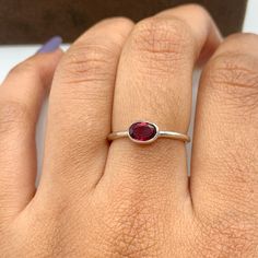 This Ring comes with a 100% Natural Garnet Gemstone and it is made up of 925 solid sterling silver. This ring is handcrafted by our skilled craftsmen and designed by us. Every gemstone is handpicked for the best quality.  Materials:- Silver (925 Solid Sterling Silver) Item Weight :- approx. 2 Grams Gemstone:- Natural Garnet Stone Size :- 6X4 MM Stone Shape :- Oval Cut Select Size in Variation , if you don't find perfect size please buy any size and message us your size we'll make. Payment Policy Classic Oval Ruby Ring Stackable, Classic Oval Stackable Ruby Ring, Oval Ruby Gemstone Stackable Rings, Oval Ruby Ring In Sterling Silver, Oval Ruby Ring In Sterling Silver As Gift, Oval Sterling Silver Stackable Rings, Oval Sterling Silver Stackable Rings Fine Jewelry, Sterling Silver Oval Cabochon Ruby Ring Gift, Oval Sterling Silver Ruby Promise Ring