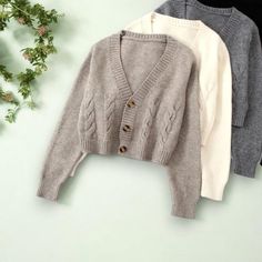 Featuring a classic cable knit design, v-neckline, and oversized fit, this cardigan is perfect for layering over your favorite fall outfits. Available in a variety of neutral colors to complement any wardrobe. Size: - Bust: 104cm, Sleeve: 60cm, Length 53cm (Please check size chart) Material: - Cotton Blend, Polyester Key Features - Chunky Cable Knit - Cropped Length - V-Neckline Please Note: Due to the handmade nature of our robes and kimonos, and variations in fabric and manufacturing processes, please allow for slight discrepancies in sizing.  Finished garment measurements may differ from the size chart by 1-3cm. We appreciate your understanding! Fall Cardigan, Cardigan Oversized, Button Up Sweater, Cable Knit Cardigan, Knit Crop, Cropped Cardigan, Cozy Fall, Knitting Designs, Kimonos