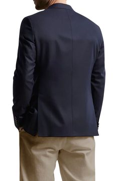 Pale buttons and dark-navy wool bring traditional detailing to a blazer that's fully lined and styled to elevate any semiformal or formal look. Notched lapels Chest welt pocket; front flap pockets; interior pocket Lined 100% wool Dry clean Made in Canada Timeless Navy Blazer For Work, Professional Navy Blazer For Formal Occasions, Navy Professional Blazer For Formal Occasions, Elegant Navy Blazer With Suit Collar, Professional Navy Blazer For Semi-formal Occasions, Navy Professional Blazer For Semi-formal Occasions, Business Blazer With Welt Pockets, Elegant Navy Blazer With Welt Pockets, Semi-formal Wool Blazer With Pressed Crease