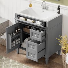 a bathroom vanity with drawers and a sink