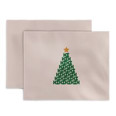 two white envelopes with a green christmas tree on them