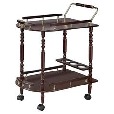 This classy serving cart will look in either your formal dining room or rec room. It features a handle pushing and top roomy top shelf for a cheese plate and two snifters of cognac. Bottom shelf includes a bottle holder for three bottles of your favorite Bordeaux andor single malt. Elegantly crafted with merlot finish and brash-finish metal accents. Gives your room a traditional countryside appeal. Color: Brown. Brass Shelving, Mobile Kitchen Island, Wood Bar Cart, Bar Serving Cart, Serving Bar, Set Dressing, Serving Cart, Furniture Classic, Serving Table