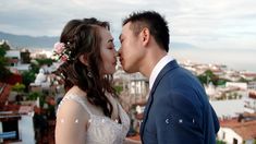 a bride and groom embracing each other on the beach