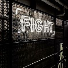 a black and white photo with the word flight written in neon letters on it's side