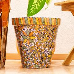 a potted plant sitting on top of a wooden table