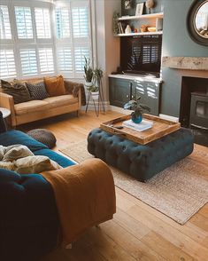 a living room filled with furniture and a fire place