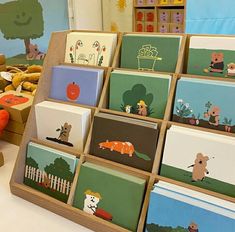 there are many cards in the box on display at the store, including animals and dogs