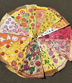 a paper plate that has different types of food on it and is sitting on the ground