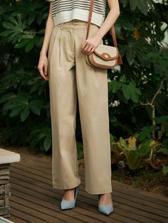 Editor's NotesThis long pants has a simple design suitable for almost all weather. With its basic design elements, it can be styled for various different looks. - Double button- Waist band- Two back pockets- Semi-loose fitMeasurements(in.)S/M- Waist: 12.6 in. / 13.39 in.- Hip: 19.29 in. / 20.08 in.- Thigh: 13.19 in. / 13.98 in.- Hem: 9.84 in. / 10.24 in.- Rise: 12.64 in. / 12.8 in.- Total Length: 41.34 in. / 41.73 in.*Model info:Height 5’8”, Chest 31, Waist 23, Hips 34, Wearing size SComposition & Care- Cotton 55% Tencel 45%- Dry clean onlyDesigner- by GENERAL IDEA Beige High-waisted Cotton Dress Pants, Casual Beige Straight Dress Pants, Beige Chinos For Fall, Fall Beige Chinos Trousers, Beige Wide Leg Chinos For Fall, Beige Straight Chinos For Business Casual, Chic Beige Chinos For Spring, Wide Leg Beige Chinos For Fall, Beige Ankle-length Chinos For Summer