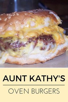 a cheeseburger with meat and onions is on a bun that says, annt kathy's oven burgers