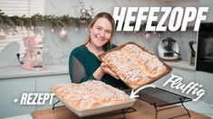 a woman holding two trays of food on top of a kitchen counter with the words heeezopf in front of her