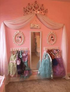 a room with pink walls and white curtains