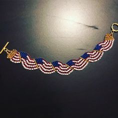 Red white and blue American flag bracelet. Glass beads with a nickel free clasp. Other sizes available. Beaded Bracelet Angolan Flag, American Flag Bracelet, Flag Bracelet, Blue American Flag, Blue Bracelet, Red White And Blue, American Flag, Bangle Bracelets, Red White