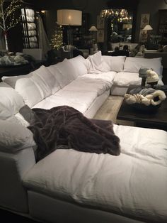 a large white couch sitting in a living room