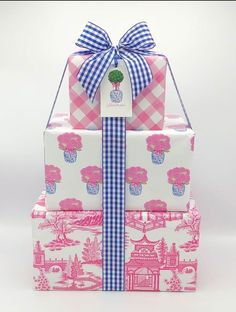 three gift boxes stacked on top of each other