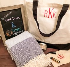 a chalkboard sign, tote bag and personalized items on a table