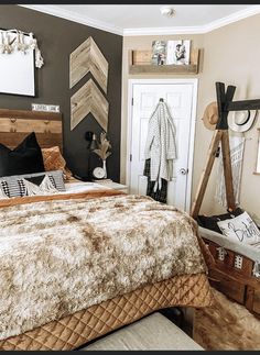 a bedroom with a bed, pillows and pictures on the wall