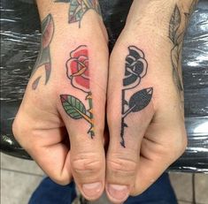 two people with tattoos on their hands and one has a rose tattoo on the other hand