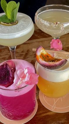 three different types of cocktails sitting on plates