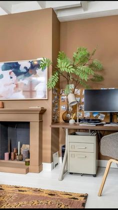 a living room filled with furniture and a flat screen tv mounted on the wall above a fire place