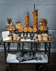 a table topped with lots of different types of pastries and desserts on top of it