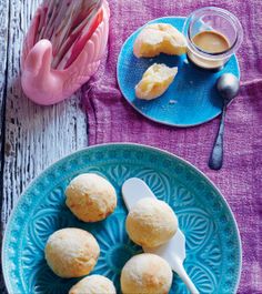 some biscuits on a blue plate with a spoon