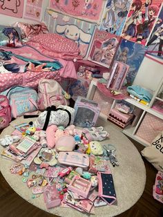 a room filled with lots of toys and items on top of a white round table