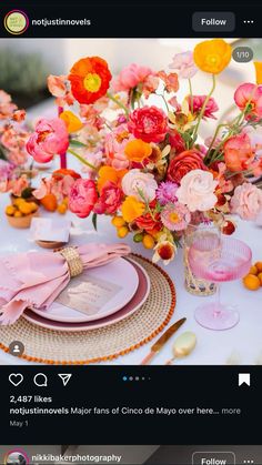 an image of a table setting with flowers in vases and plates on the table